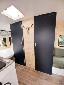 a room with a door with a cow head on the wall at La Cour d'Hortense in Sailly-Flibeaucourt +223 photos