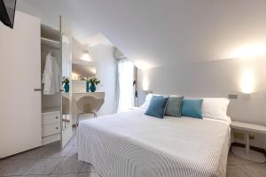 Postel nebo postele na pokoji v ubytování Hotel Adriatica con Piscina