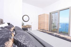 Postel nebo postele na pokoji v ubytování Vlachos Maisonette