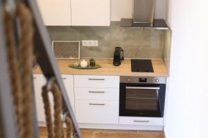 Kuchyň nebo kuchyňský kout v ubytování Vlachos Maisonette