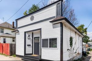 a white house with a door on the side of it at 2 bedroom home in Dayton in Dayton