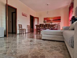 a living room with a couch and a table at B&B da Giovy in Marsala