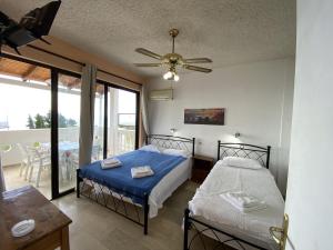 A bed or beds in a room at Andromaches large apartment 2
