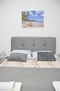 Postel nebo postele na pokoji v ubytování APARTMENTS ANDREA