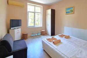 En eller flere senge i et værelse på Mateo Center