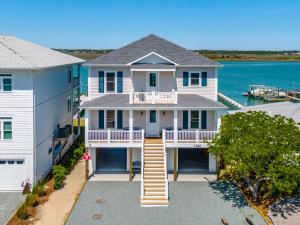 an aerial view of a house with a dock at Channel 6 in Surf City