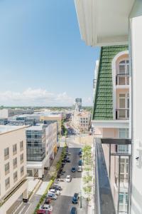 a view of a city street from a building at 2 BR 5 pax Spacious Elegant Condo in Saint Dominique, Megaworld, Iloilo City in Iloilo City
