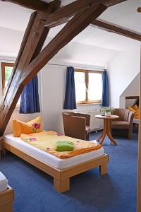 a bedroom with a large bed in a room at Motel an der B180 in Steigra