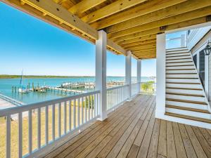 a deck with a view of the water and a marina at Channel 6 in Surf City +115 photos
