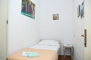Postel nebo postele na pokoji v ubytování APARTMENTS ANDREA