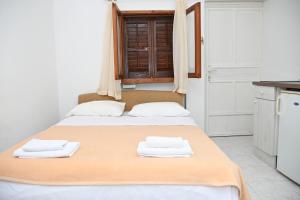 Postel nebo postele na pokoji v ubytování APARTMENTS ANDREA