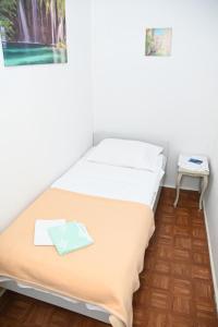 Postel nebo postele na pokoji v ubytování APARTMENTS ANDREA