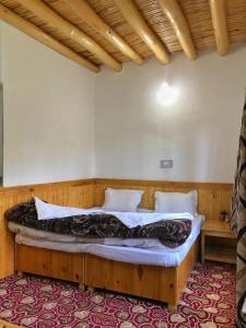 Postel nebo postele na pokoji v ubytování Sponbo Guest House, Leh