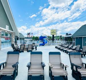 a group of chairs and a playground with a slide at The Walden, Trademark Collection By Wyndham in Pigeon Forge