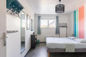 Ένα ή περισσότερα κρεβάτια σε δωμάτιο στο La Dame de cœur 05