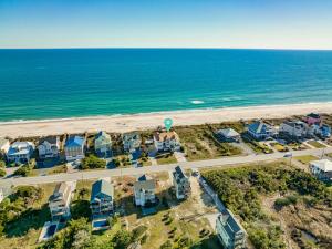 an aerial view of the beach with houses and the ocean at Coppertop in North Topsail Beach