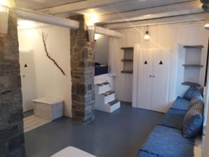 a room with a hallway with a door and shelves at Villa Antinaxos in Ambelas