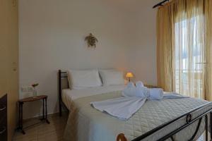 Postel nebo postele na pokoji v ubytování Zeusplace Leptokarya Seaside Apartment