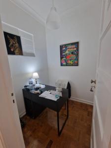 an office with a desk in a room at Boa Noite Casa de Hospedes in Lisbon