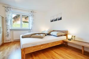 Łóżko lub łóżka w pokoju w obiekcie Apartments Kirchebnerhof