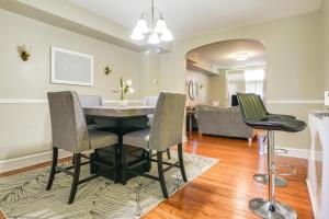 a living room with a dining table and chairs at Baltimore Vacation Rental - Near JHU and Art Museum! in Baltimore