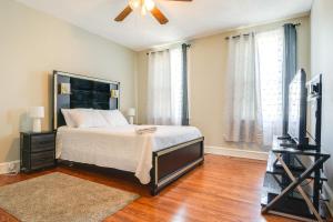 a bedroom with a bed and a television in it at Baltimore Vacation Rental - Near JHU and Art Museum! in Baltimore