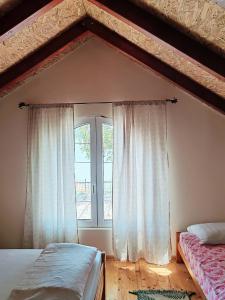 Postel nebo postele na pokoji v ubytování Dadula na Dunavu