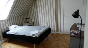 Postel nebo postele na pokoji v ubytování Cosy room in residential part of Copenhagen, with free street parking and shared bathroom
