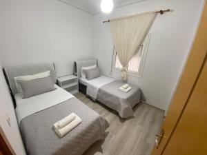 Postel nebo postele na pokoji v ubytování PatZOO Apartments