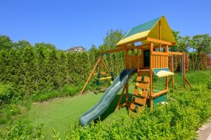 a playground with a slide and a play structure at Azur Properties 74 in Shkorpilovtsi