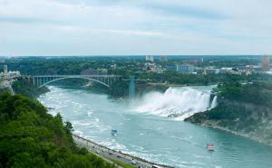 a view of a river with a bridge and waterfall at Niagara Falls Marriott Fallsview Hotel & Spa in Niagara Falls