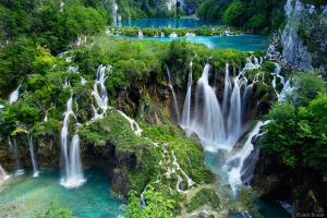 a group of waterfalls in a river with trees at Noel's dreams in Praputnjak +24 photos