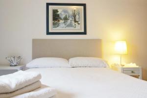Uma cama ou camas num quarto em Casa do O - Alojamento Local