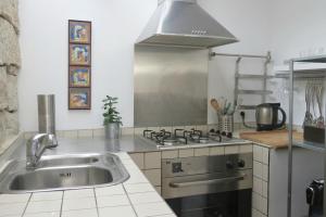 A cozinha ou kitchenette de Casa do O - Alojamento Local