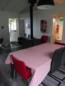 a room with a table with a checkered table cloth on it at Maison Marcotte in Saint-Michel
