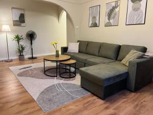 a living room with a couch and a table at Vonn Apartment in Tallinn City Centre in Tallinn +17 photos