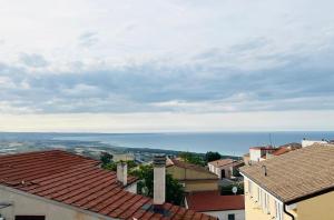 a view of the ocean from the roofs of buildings at Antico Borgo sul Mare in Petacciato