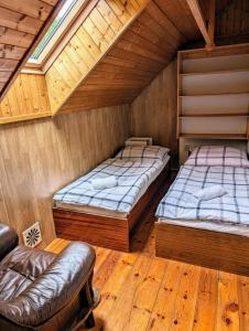 Postel nebo postele na pokoji v ubytování apartmán v pensionu U Holzäpfelů