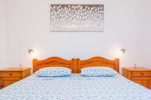 Postel nebo postele na pokoji v ubytování Apartmani Pina