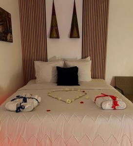 Giường trong phòng chung tại Appartement jacuzzi maison spa