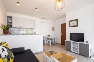Kuchyň nebo kuchyňský kout v ubytování Apartmani Pina