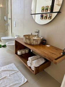 a bathroom with a sink and a mirror at Villa Central Palms in Palasë +24 photos