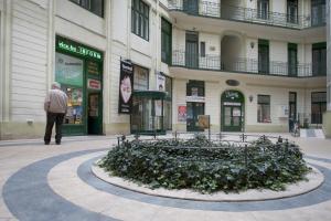 a man standing in front of a building at Alice Apartment in Budapest