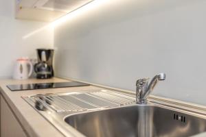 Kuchyň nebo kuchyňský kout v ubytování Apartmani Pina