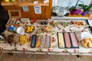 a table with different types of food on it at Hostel Mama Minka in Bohinj +29 photos