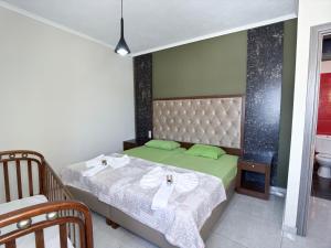 a bedroom with two beds and a sink at Elafonisi Paradise with Parking, WiFi, - Walking Distance to the Beach in Elafonisi