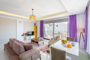 a living room with a couch and a table at Blue View Suites Kaş in Kas