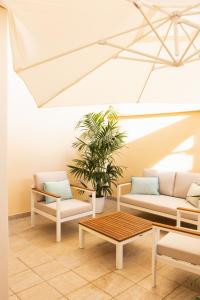 Posezení v ubytování New Elegance Suites Guesthouse