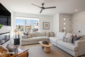 a living room with a couch and a ceiling fan at Desert Dream at Desert Color (by Ember Stays) in St. George
