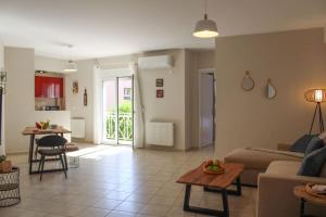 a living room with a couch and a table at Apartment Lucia in Argostoli